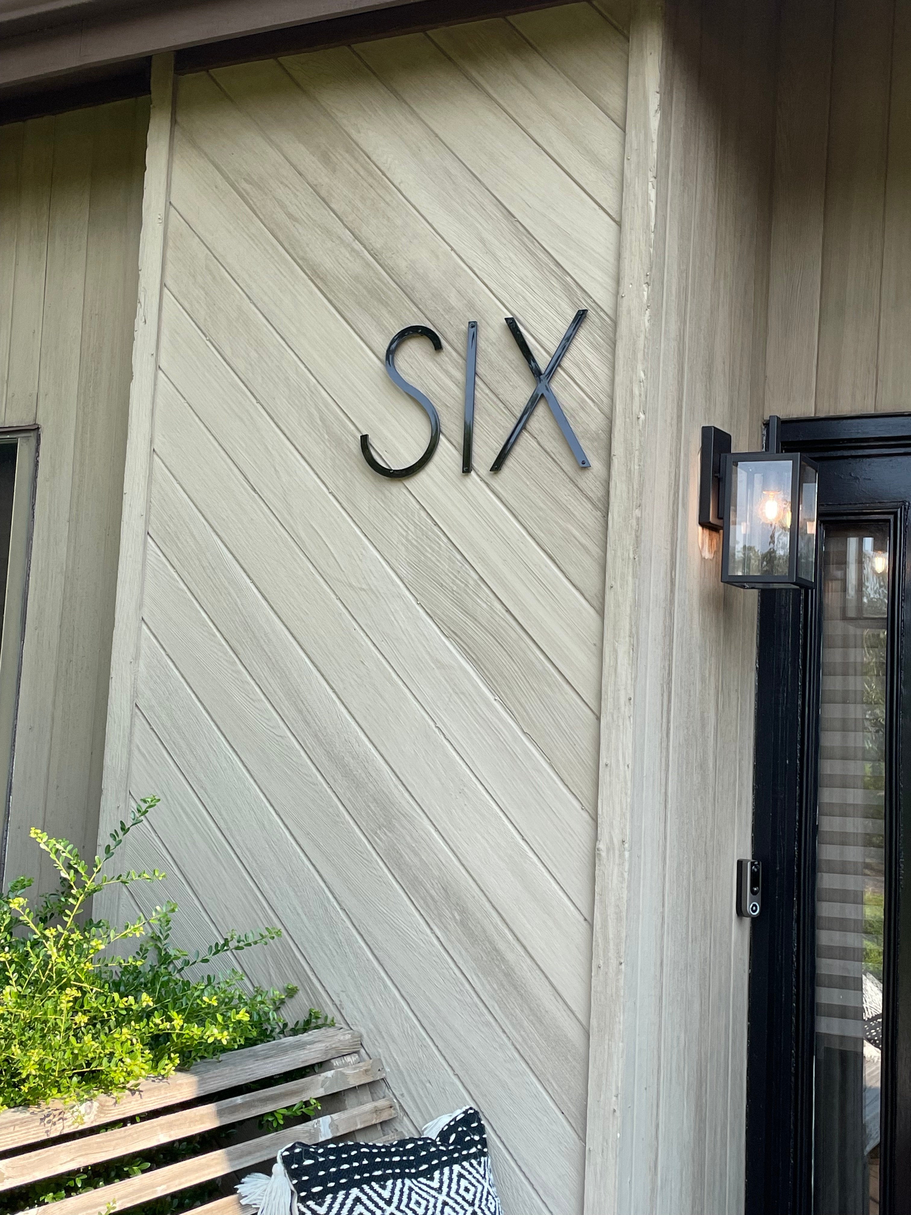 Spell number six with thin modern letters for a modern address number