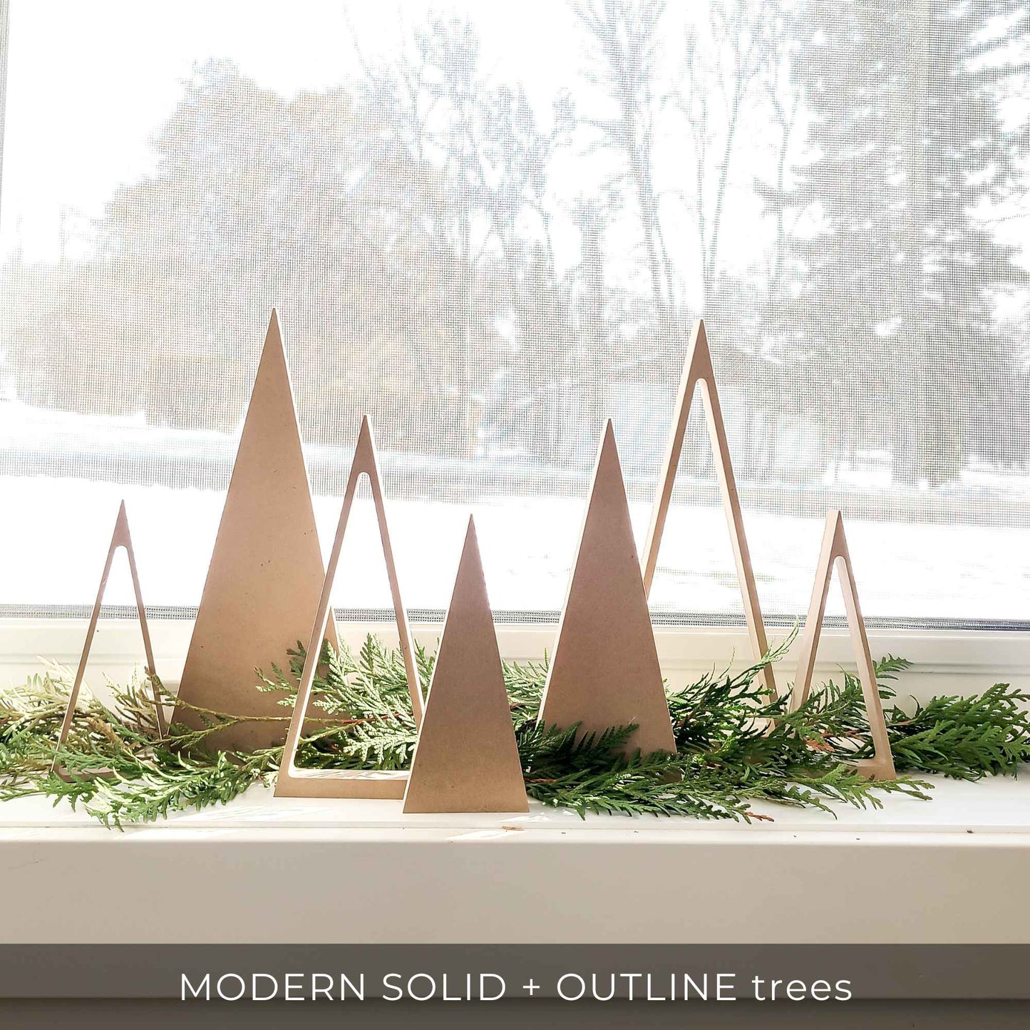 Wooden tree decor on window ledge for Modern Christmas decor 