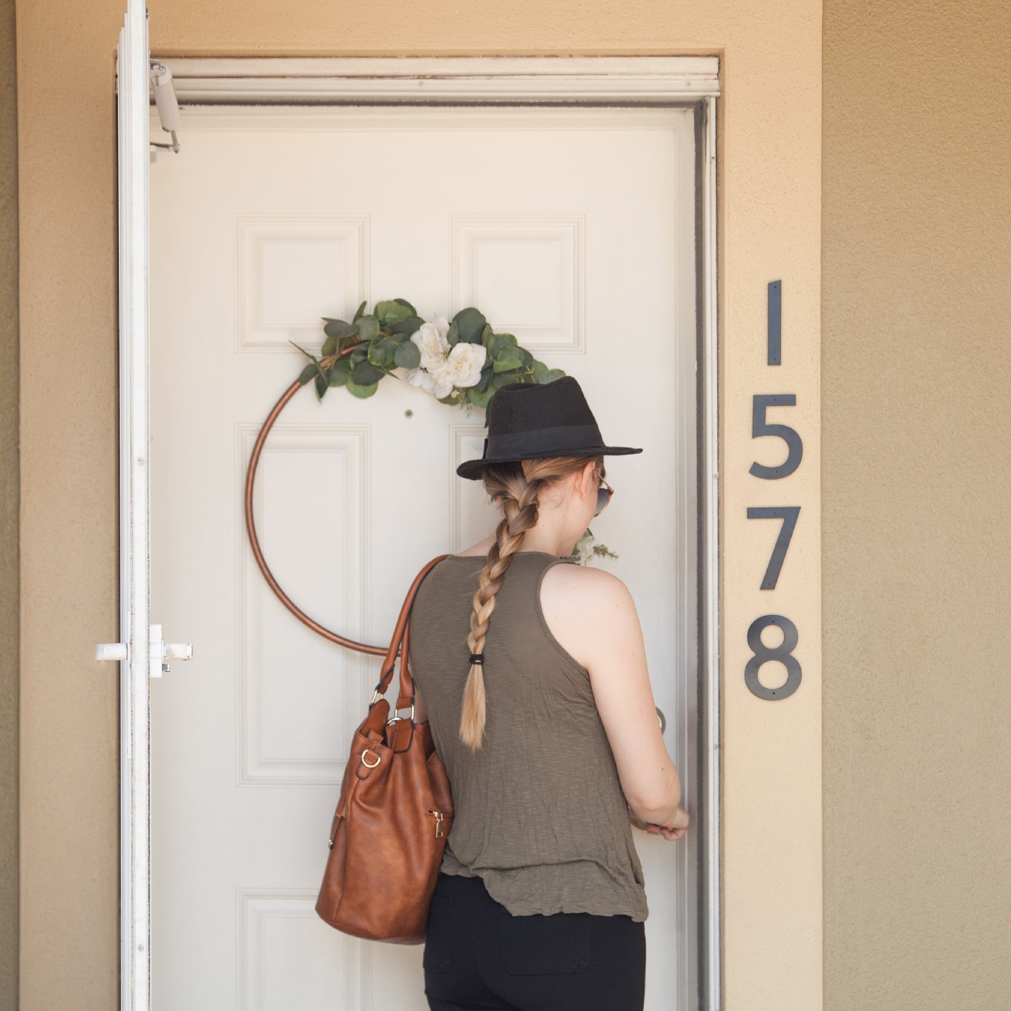 Classic Modern house numbers mounted vertically beside door