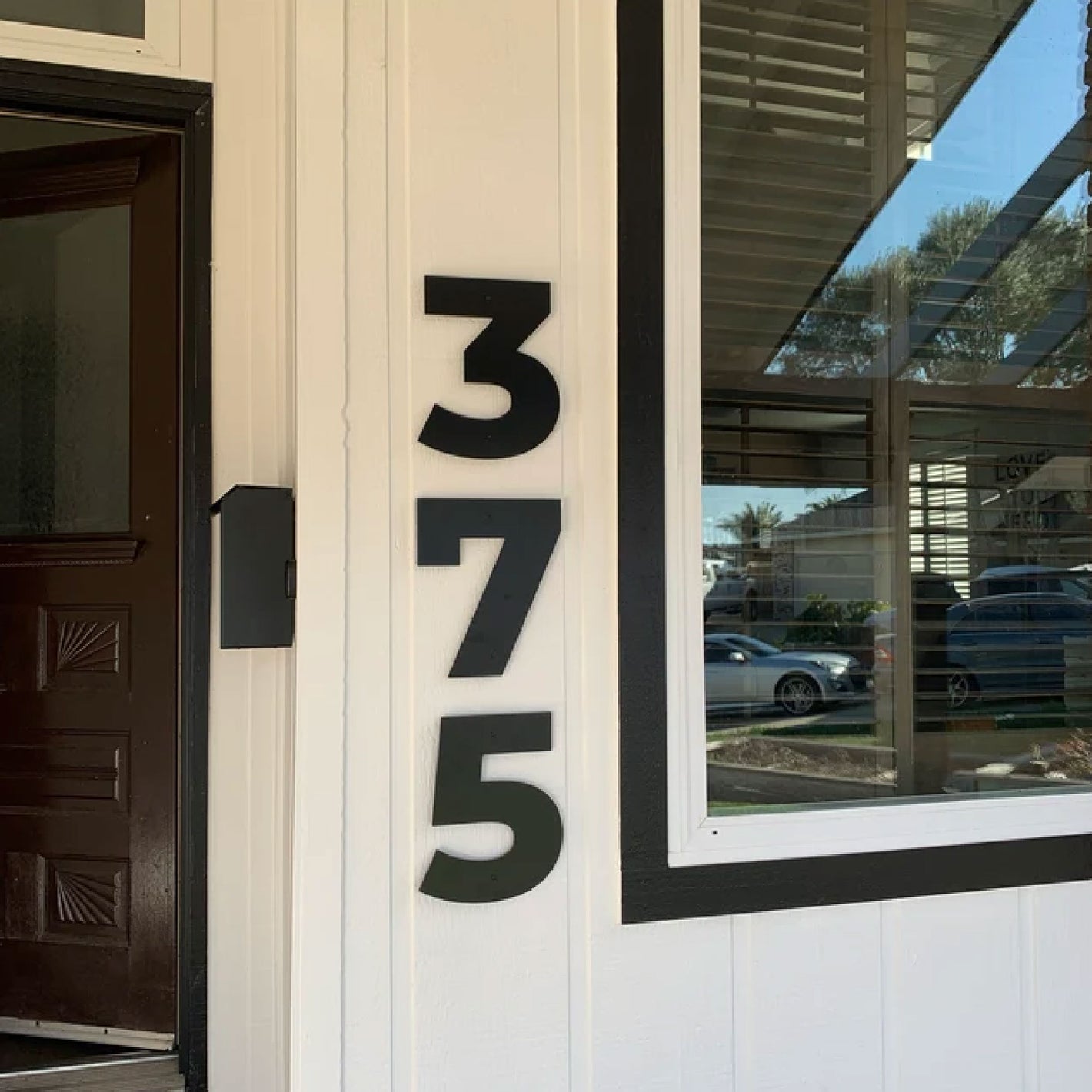 Bold house numbers in black for address sign