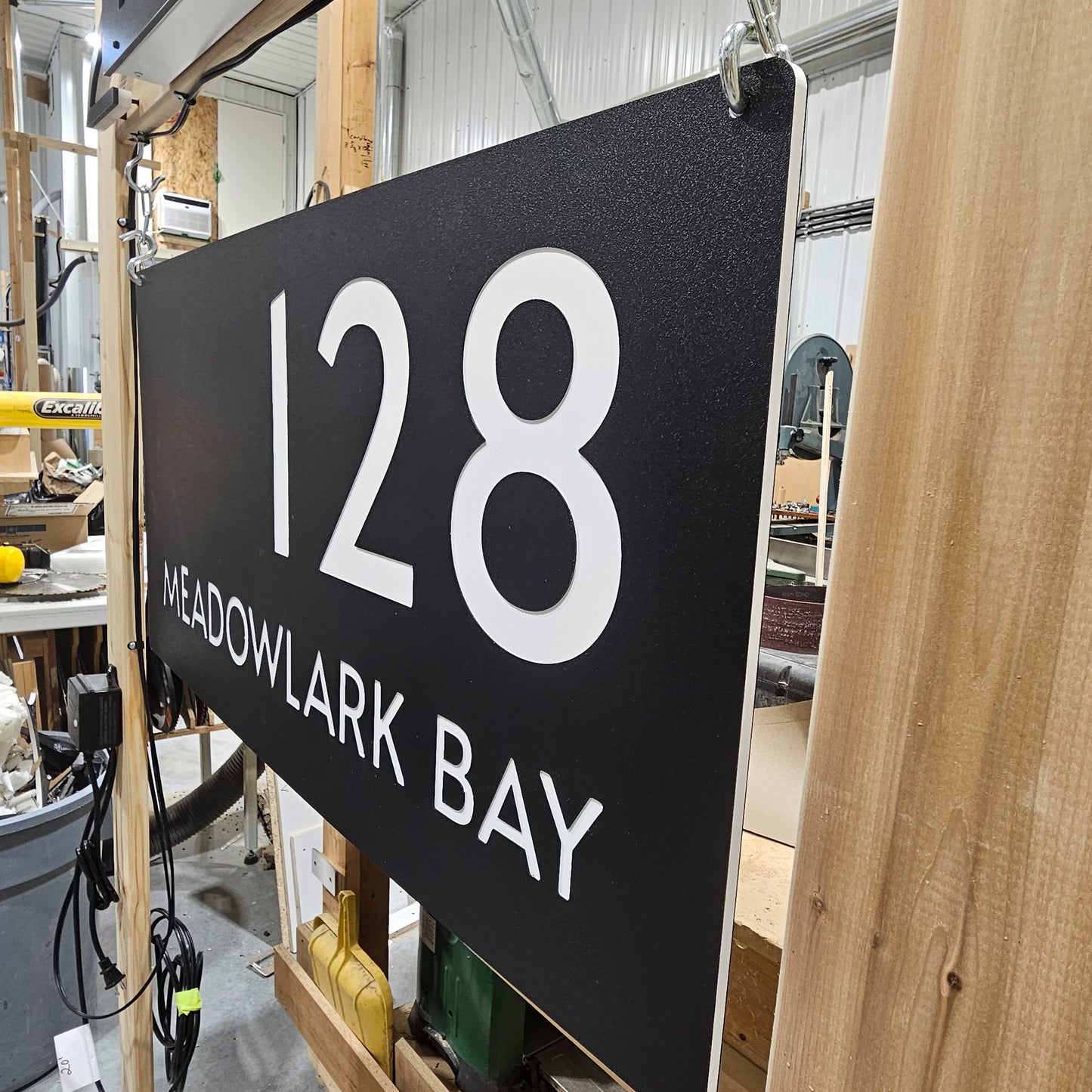 Side view showing white core of Engraved Address Sign with personalized name and street options