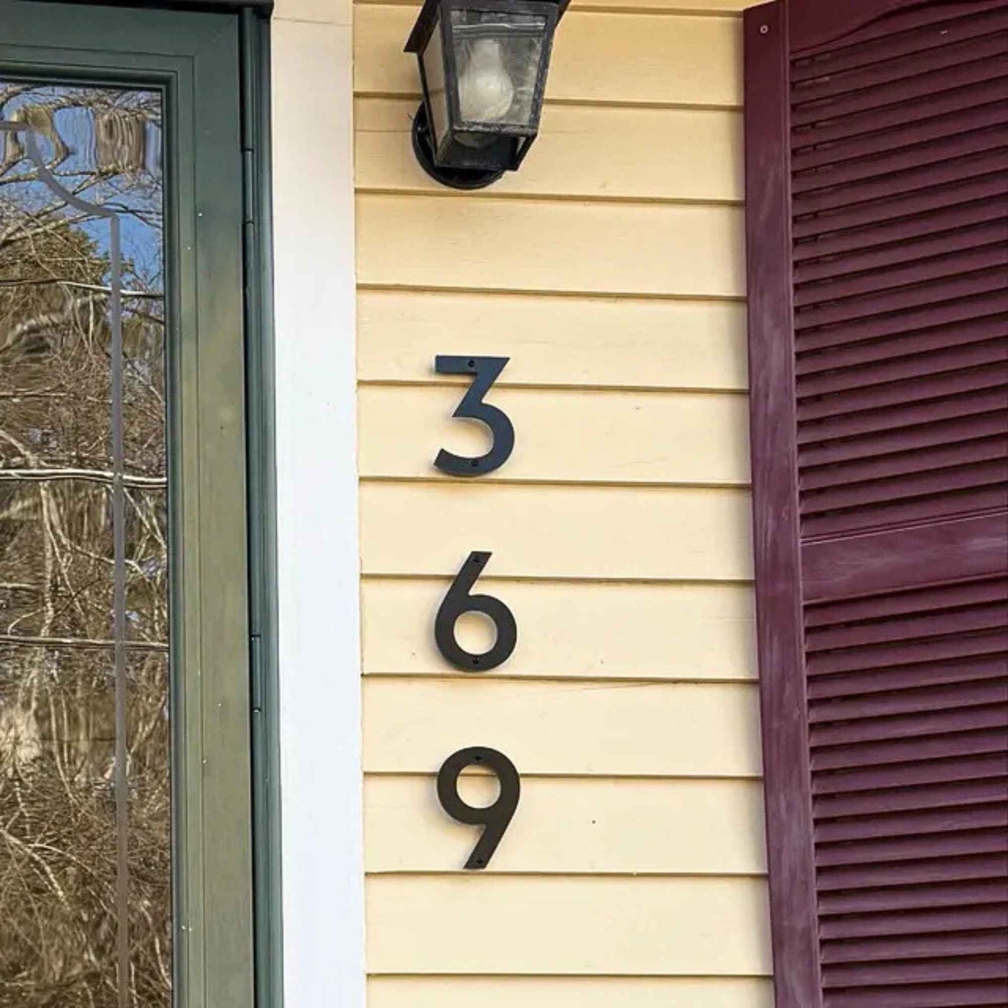 5 inch CLASSIC MODERN house numbers on yellow siding shown