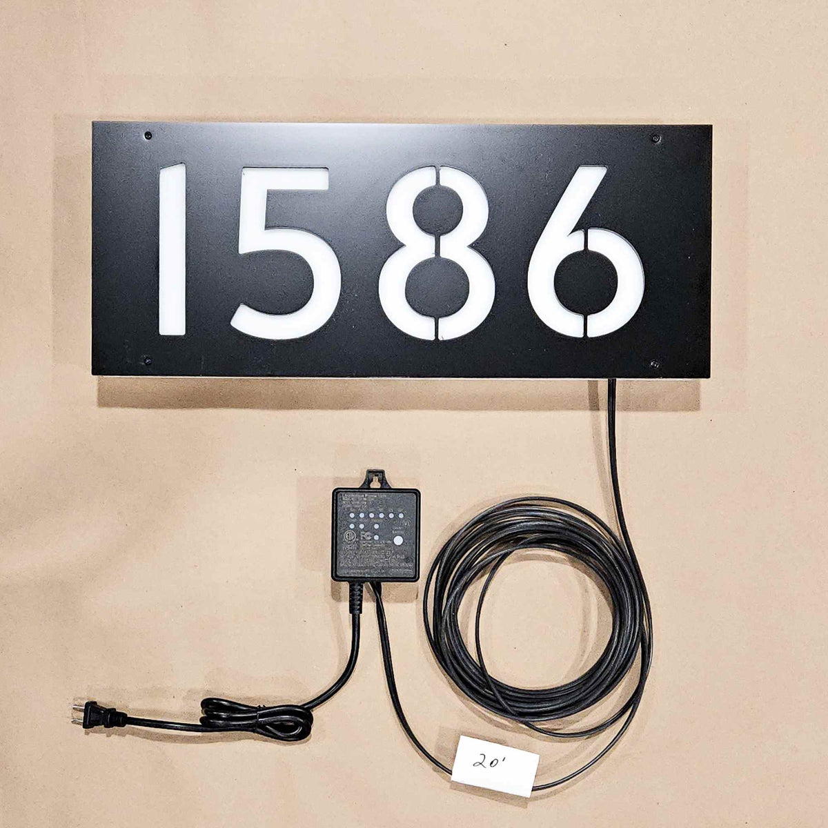 Backlit House number sign with power cable and and light sensor