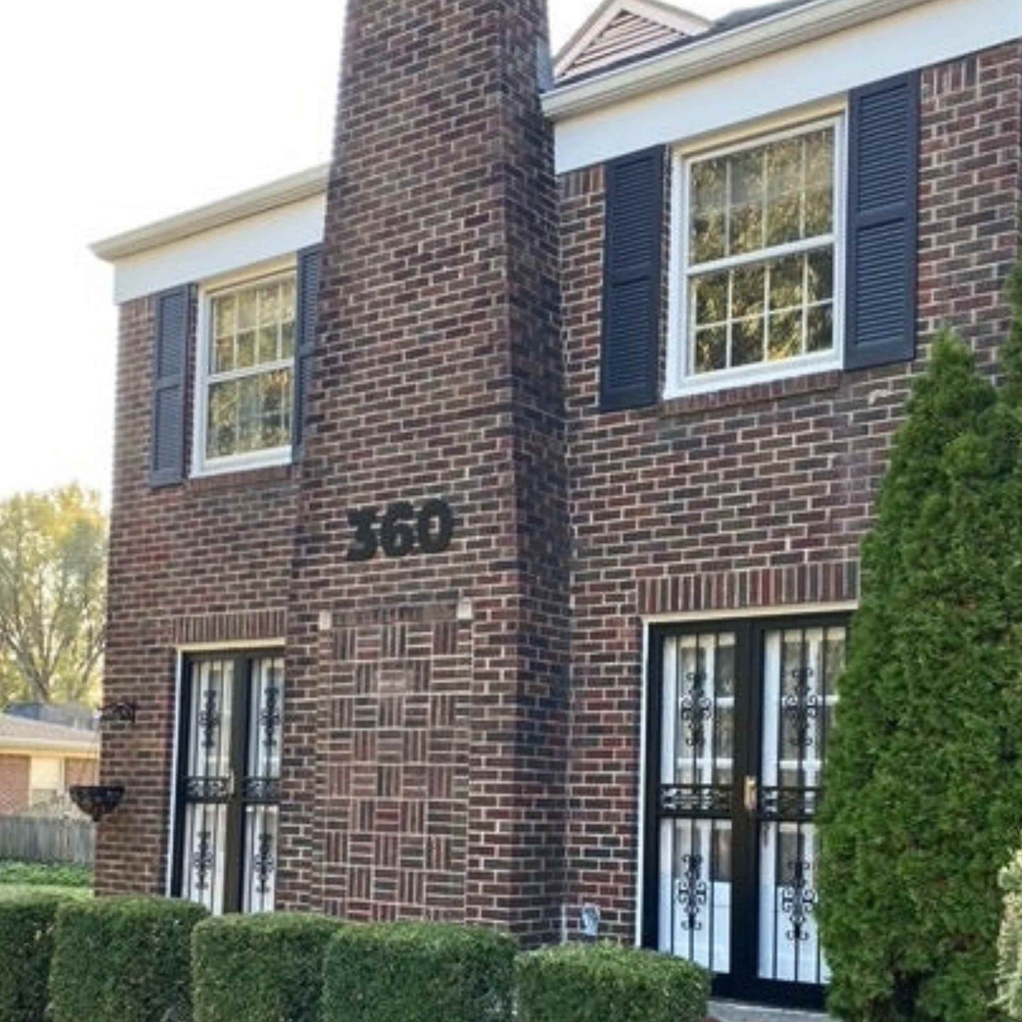 showing 12 inch BOLD RETRO address numbers on a brick building