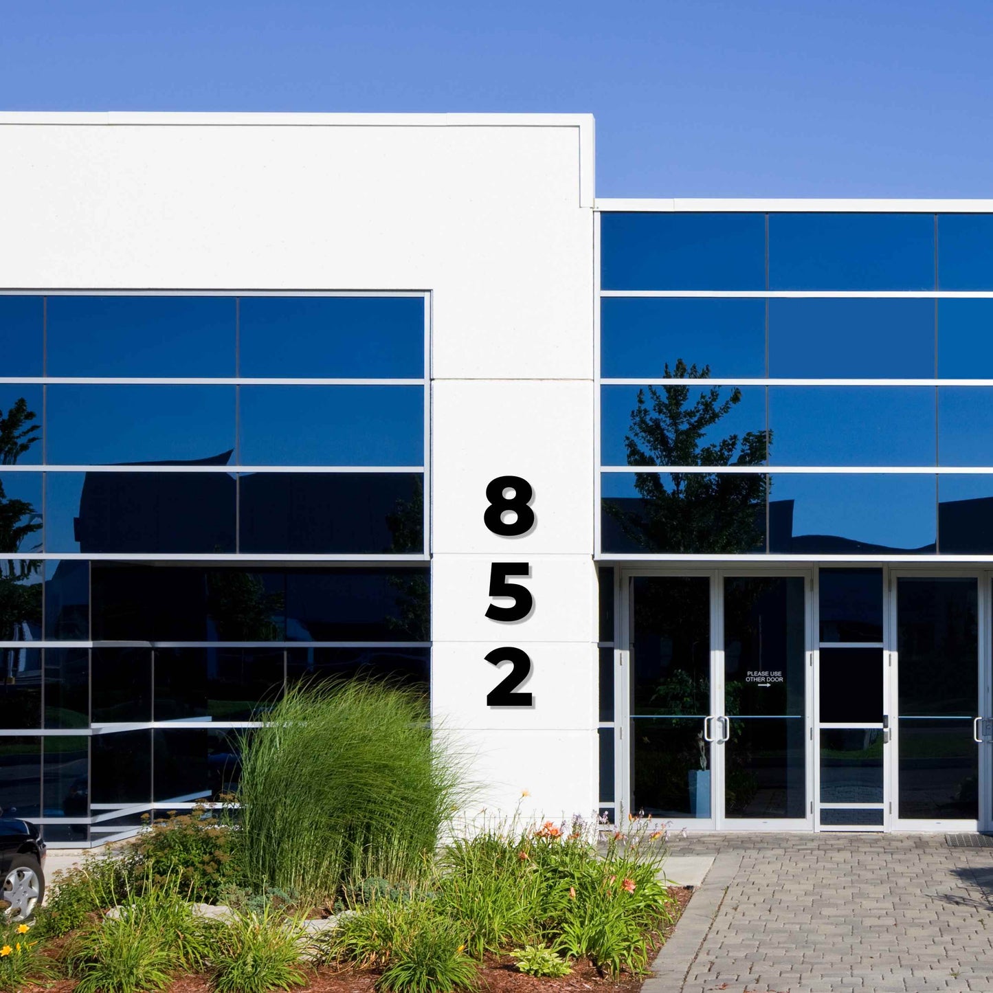 showing how 24 inch BOLD RETRO address numbers would look like on a commercial building