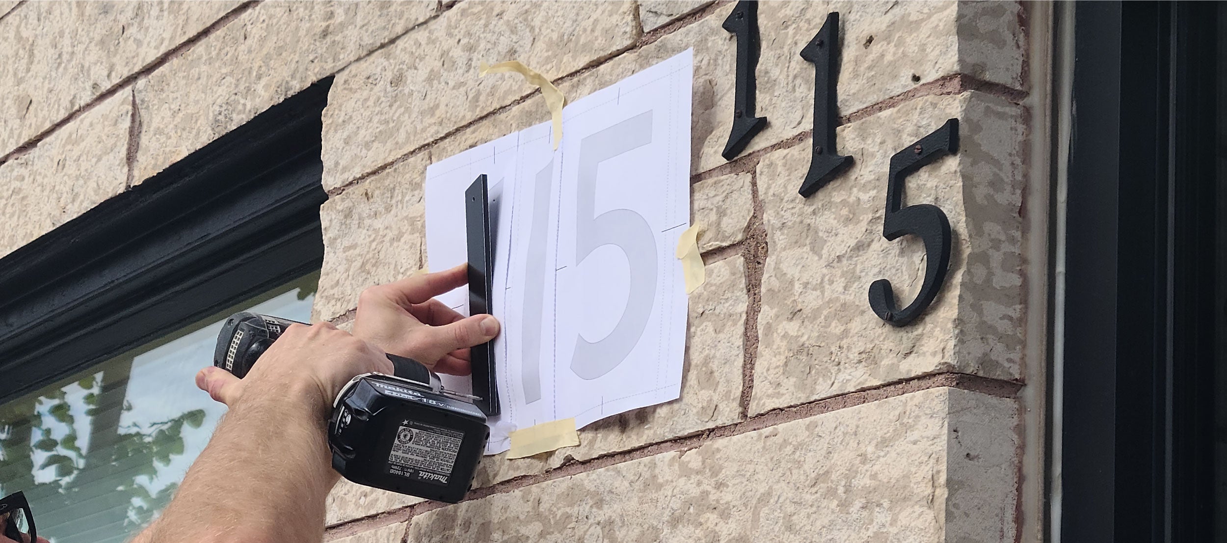 Installation template for house numbers being used